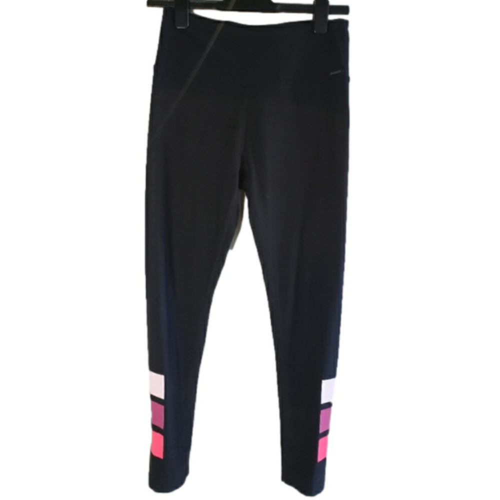 Mondetta black leggings with pink graphic elements on bottom of the leg